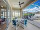 Cozy screened lanai with seating, a ceiling fan, and views of the pool area at 331 Henley Cir, Davenport, FL 33896