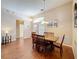 Bright living room with wood floors, neutral paint, a dining table, and ample natural light at 331 Henley Cir, Davenport, FL 33896