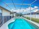 Inviting screened-in pool area with a beautiful, crystal-clear pool and comfortable lounge chairs at 331 Henley Cir, Davenport, FL 33896