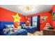 Vibrant 'Super Mario' themed bedroom with twin beds, playful decor, and bright colors for a fun and inviting space at 3348 Lilac Way, Davenport, FL 33897