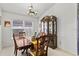 Dining room featuring a wooden table and chairs set beneath a decorative chandelier at 3414 Willow Branch Ln, Kissimmee, FL 34741