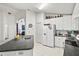 Kitchen featuring bright lighting, white cabinets, and breakfast bar overlooking the dining area at 3414 Willow Branch Ln, Kissimmee, FL 34741