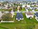 An aerial view of a residential community near a pond, and well-maintained lawns at 3431 Perching Rd, St Cloud, FL 34772