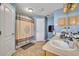 Bathroom featuring double sinks and a shower with decorative shower curtain at 3642 Doe Run Dr, St Cloud, FL 34772