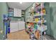 Laundry room with washer, dryer, and shelving for storage and supplies at 3642 Doe Run Dr, St Cloud, FL 34772