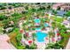 Fantastic aerial view of the large community pool, featuring a lazy river and waterslides at 3939 Calabria Ave, Davenport, FL 33897