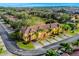 Aerial view of townhouses featuring lush landscaping and a well-maintained neighborhood, perfect for comfortable living at 3939 Calabria Ave, Davenport, FL 33897