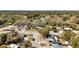 Aerial view of the neighborhood with mature trees and varying house sizes at 415 N Winter Park Dr, Casselberry, FL 32707