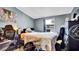 Bedroom featuring a bed with patterned comforter, and a black dresser at 415 N Winter Park Dr, Casselberry, FL 32707