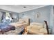 Stylish bedroom features comfortable seating, a desk and light blue walls at 415 N Winter Park Dr, Casselberry, FL 32707