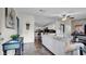 Bright living room featuring wood floors, a ceiling fan, and an open layout to the kitchen at 415 N Winter Park Dr, Casselberry, FL 32707