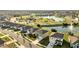 Aerial view of a residential neighborhood with a pond and fountain at 417 Noble Ave, Davenport, FL 33837