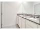 Elegant bathroom with a double vanity featuring granite countertops and sleek fixtures at 417 Noble Ave, Davenport, FL 33837