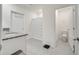 Bright bathroom featuring double sinks, granite countertop and a separate toilet room at 417 Noble Ave, Davenport, FL 33837