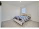 Well-lit bedroom with a cozy bed and soft carpeting at 417 Noble Ave, Davenport, FL 33837