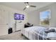 Bedroom view with a bed placed near window and a dresser at 417 Noble Ave, Davenport, FL 33837