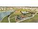 Expansive community park featuring a pool, playground, pond, and walking paths at 417 Noble Ave, Davenport, FL 33837