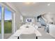 Open-concept dining area with a view to the living room, which features a sliding glass door to backyard at 417 Noble Ave, Davenport, FL 33837