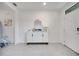 Bright entryway with tile floors, console table, and white front door at 417 Noble Ave, Davenport, FL 33837