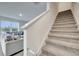 Living room view with stairs on the side at 417 Noble Ave, Davenport, FL 33837