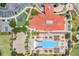 Aerial view of the clubhouse and pool area, landscaped grounds and ample parking at 4506 Alberto Cir, Kissimmee, FL 34746