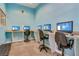 Community computer room with multiple workstations and comfortable seating at 4506 Alberto Cir, Kissimmee, FL 34746