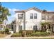 Charming two-story home featuring a red tile roof, well-manicured landscaping and neutral color palette at 4506 Alberto Cir, Kissimmee, FL 34746