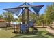 Community playground with a shade cover, slides and other fun activities for  at 4506 Alberto Cir, Kissimmee, FL 34746