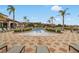 Relaxing pool area with lounge chairs and palm trees at this beautiful community at 4506 Alberto Cir, Kissimmee, FL 34746