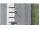Overhead view of property showcasing roofline, walkway, and parking area with a blue vehicle at 4846 Coral Castle Dr, Kissimmee, FL 34746