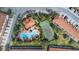 Aerial shot showcasing the community pool, tennis court, and lush landscaping at 4846 Coral Castle Dr, Kissimmee, FL 34746
