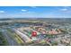 Wide aerial shot of the townhome community with beautiful landscaping, lakes, and a great location near the highway at 4846 Coral Castle Dr, Kissimmee, FL 34746