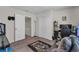 A modern bedroom featuring a closet, gaming setup, and comfortable seating area at 4846 Coral Castle Dr, Kissimmee, FL 34746