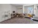 A cozy bedroom offering natural light, a spacious closet, and shelving at 4846 Coral Castle Dr, Kissimmee, FL 34746