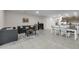 Open concept living area with tile flooring, comfortable seating, and dining space at 4846 Coral Castle Dr, Kissimmee, FL 34746