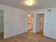 Bright bedroom features tile floors with access to the bathroom at 5116 Conroy Rd # 12, Orlando, FL 32811