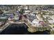 Aerial view showcasing the delightful community with views of the central lake at 614 Golfpark Dr, Kissimmee, FL 34747