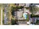 An aerial view shows the property with a backyard pool, mature trees, and a defined property line at 614 Golfpark Dr, Kissimmee, FL 34747