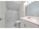 Bathroom featuring white vanity, a stylish shower with glass door and unique ceiling at 614 Golfpark Dr, Kissimmee, FL 34747