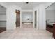 Bathroom showcasing a soaking tub, shower, tile flooring, and natural light at 614 Golfpark Dr, Kissimmee, FL 34747