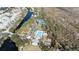 Aerial view of the community pool, tennis courts, and playground for outdoor recreation at 614 Golfpark Dr, Kissimmee, FL 34747