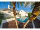 Backyard view showcasing a private in-ground pool with a white fence at 614 Golfpark Dr, Kissimmee, FL 34747