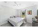 Cozy bedroom featuring tile floors, a ceiling fan, and a sunlit window at 6495 Eve St, St Cloud, FL 34771