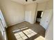 An empty bedroom featuring a closet, ceiling fan, and ensuite bathroom at 650 Tuscan Hills Blvd, Davenport, FL 33897