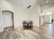 Dining area showcases contemporary chandelier and transitions to the front entrance at 650 Tuscan Hills Blvd, Davenport, FL 33897