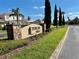 Tuscan Hills entrance sign with beautiful landscaping and well-maintained lawns at 650 Tuscan Hills Blvd, Davenport, FL 33897