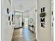 Bright foyer with a decorative light fixture, high ceilings, and wood-look floors at 650 Tuscan Hills Blvd, Davenport, FL 33897