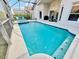 Inviting screened-in pool area with a spa and a covered patio at 650 Tuscan Hills Blvd, Davenport, FL 33897