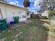 Backyard features a lush lawn and privacy fence at 710 E Arizona Ave # A, Deland, FL 32724