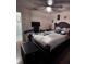 Bedroom featuring wood flooring, ceiling fan, tv and a dresser at 710 E Arizona Ave # A, Deland, FL 32724
